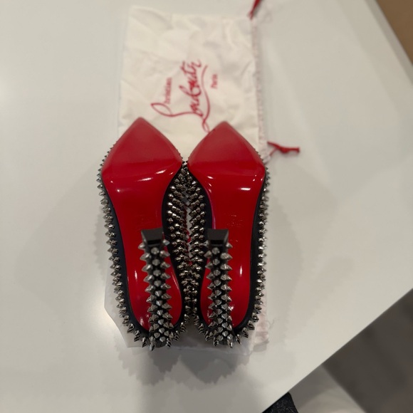 CHRISTIAN LOUBOUTIN
Condora Leather Spikes Red Sole Pumps